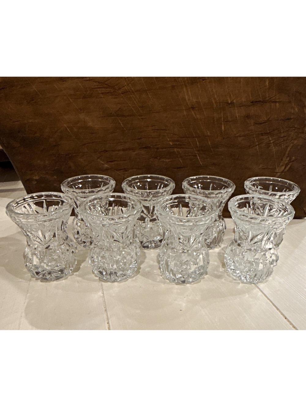This is a set of 8 vintage cut crystal toothpick holders with starburst pattern